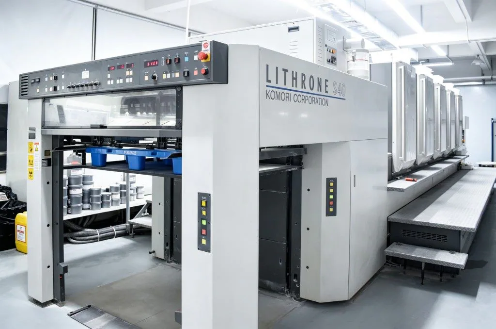 The offset press line inside the plant, an in-house color shop for retail cat scratchers artwork.